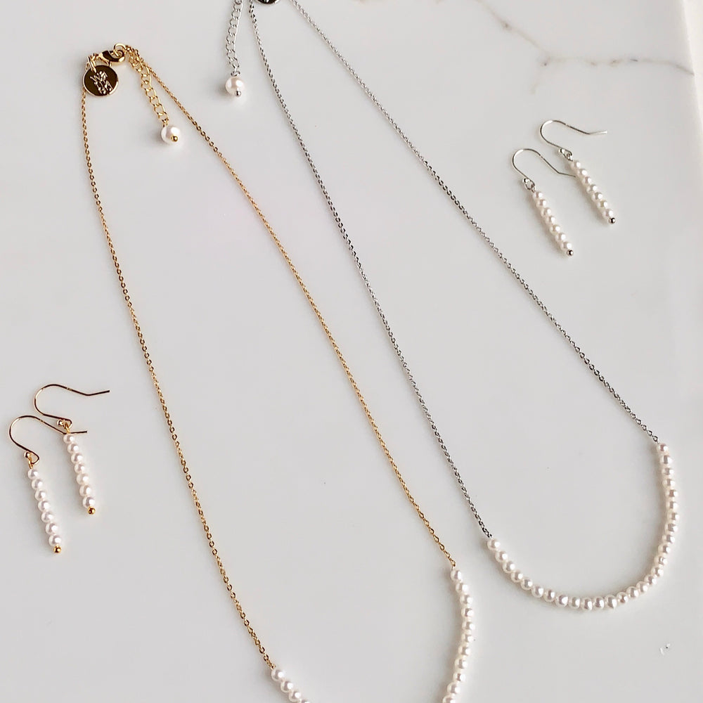 
                      
                        3mm Freshwater White Pearls on Yellow or White Gold 18” Chain with 1.25” Extender for this Delicate and Classic Necklace which can also be Worn Layered with other Favorites.  Both Colors shown with Matching Earrings.
                      
                    